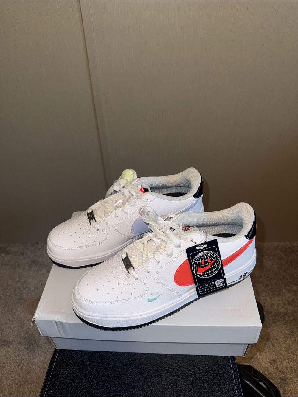 Nike Kids White Sneakers with Coral Swoosh and Black Heel